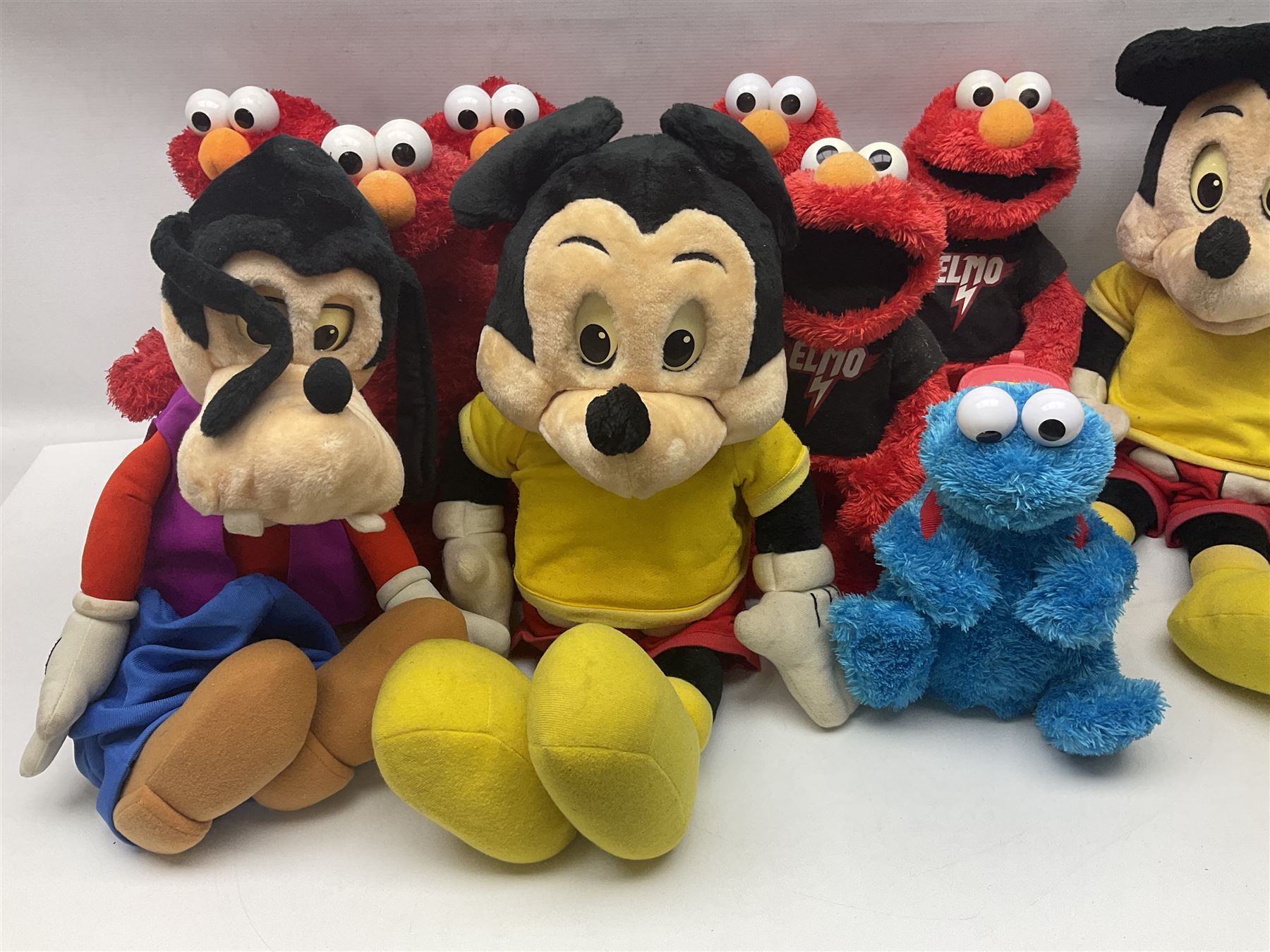 Collection of Sesame Street Elmo, together with Teletubbies and Disney toys etc in two boxes
