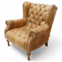 Alexandra & James - Late 20th century wingback armchair, with deep buttoned back and seat,...