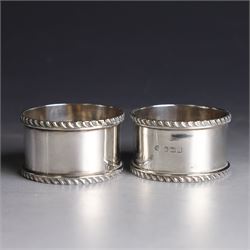 Pair of early 20th century silver napkin rings, plain circular form with oblique gadrooned rim, no engravings, hallmarked William Hutton & Sons Ltd, Sheffield 1912
