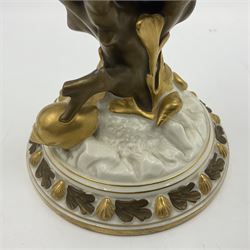 A late 19th Century Royal Worcester vase modelled as a nautilus shell surmounted by a gilt lizard, raised upon a naturalistically modelled gilt coral stem, and spreading base detailed with sea shells and formal shell border to edge, with puce mark beneath with date cypher for 1887, and impressed mark, H22cm

