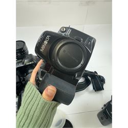 Six Minolta Dynax SLR camera bodies, comprising 800si serial no. 62703606, three 7xi examples, including one boxed example, serial nos. 20106944, 16123311 & 22107553, and two 9xi examples, serial no. 18209901 & 18202113, with three Minolta lenses, including Zoom xi 28-105mm 1:3.5(22)-4.5 lens, AF Zoom 28-85mm 1:3.5 (22)-4.5 lens and an AF Zoom 75-300mm 1:4.5(32)-5.6 lens, Hama carry case and other accessories