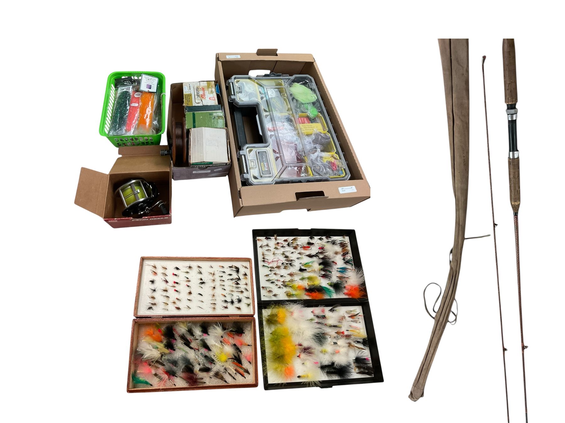 Two boxes of assorted fly fishing flies together with can fishing rod and other fishing tackle