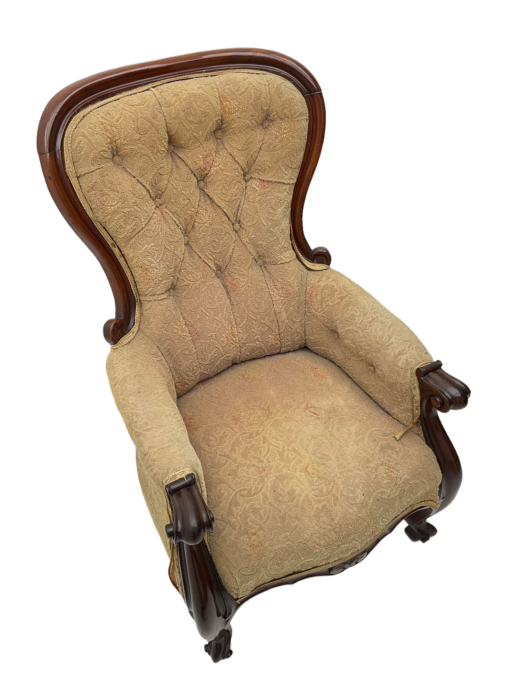 Victorian mahogany upholstered armchair, moulded framed, scroll carved arm terminals on scrolled cabriole supports, shaped carved apron