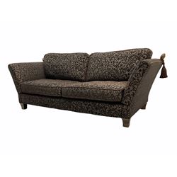 Contemporary Knole type three seat drop arm sofa, upholstered in brown fabric with raised foliate pattern 