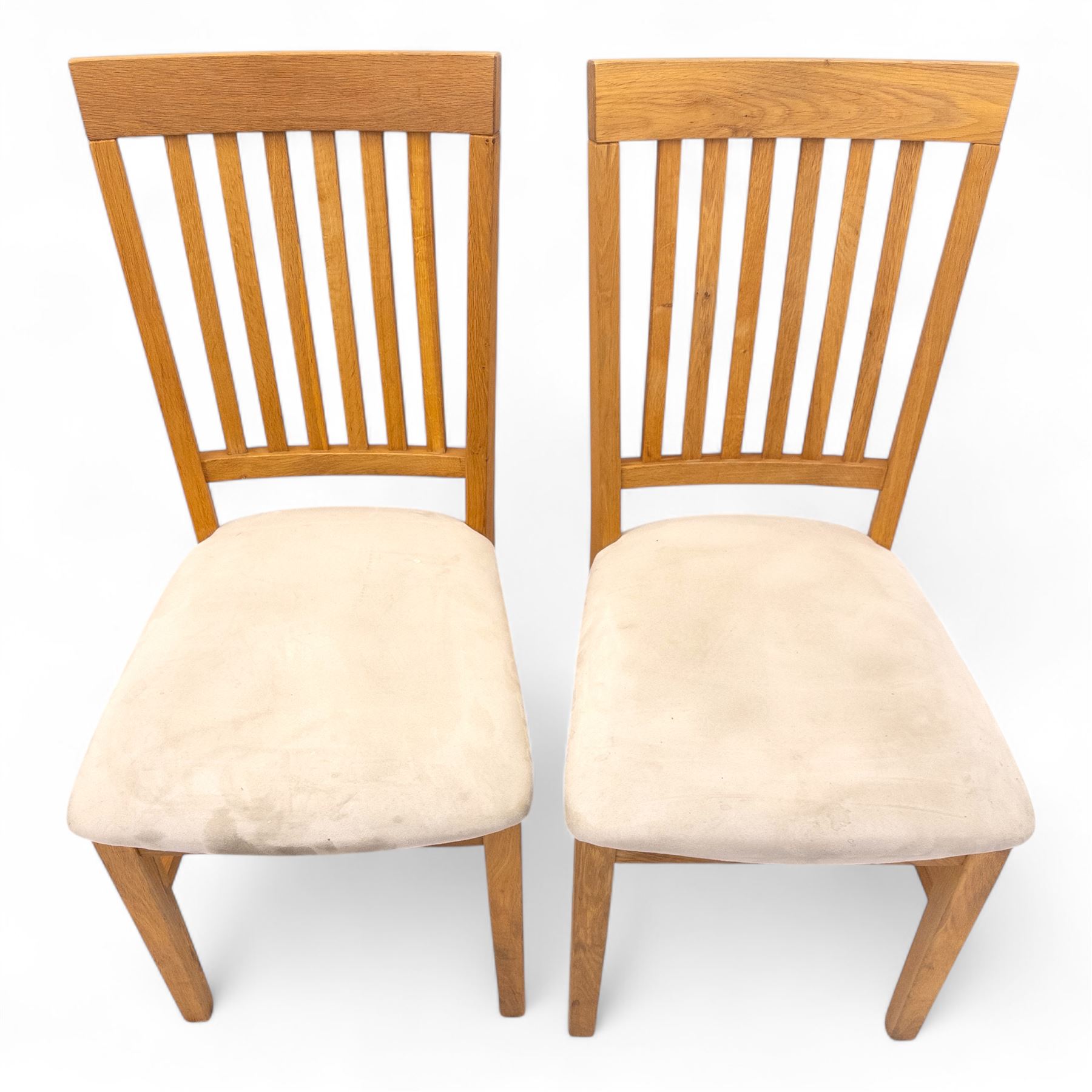 Contemporary solid oak rectangular dining table, with two additional extension leaves, together with eight matching high back dining chairs upholstered in cream suede-effect fabric (9) (Chair H 95cm, W 41cm, D 53cm) (Extends to 270cm)