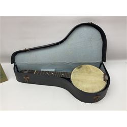 George Formby banjolele with metal plaque to headstock L55cm; in carrying case with instruction booklet.
