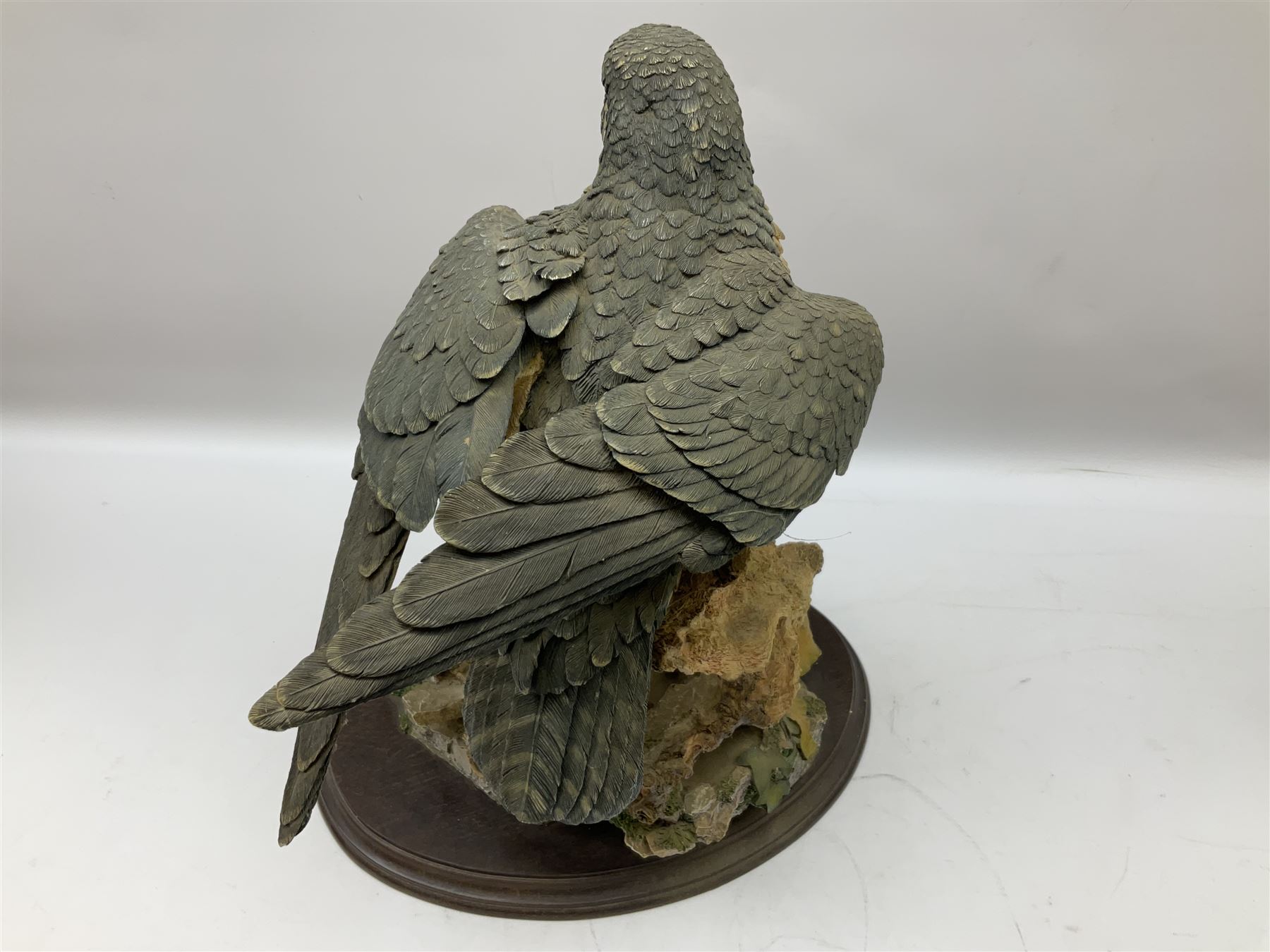Country Artists figure of a peregrine falcon ' Lord of the Skies ' by David Ivey, limited edition, H44cm, together with two Sherratt and Simpson figures, both of peregrine falcons perched on branches. 