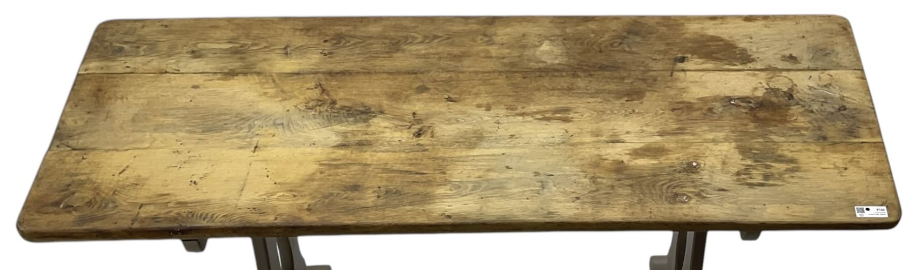 20th century oak refectory dining table, rectangular stripped top on painted base, shaped end supports on sledge feet united by two pegged stretchers
