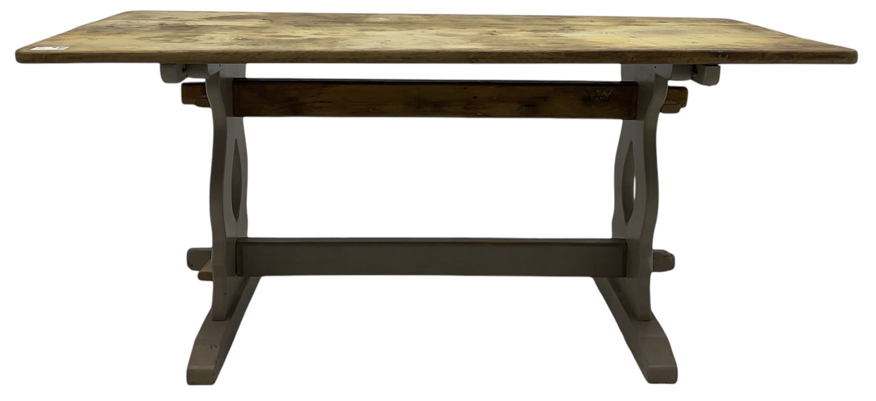 20th century oak refectory dining table, rectangular stripped top on painted base, shaped end supports on sledge feet united by two pegged stretchers