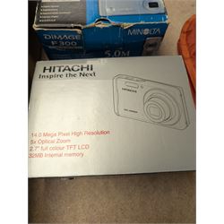 Minolta Dimage F300 digital camera and a Hitachi HDC-1499 digital camera, both boxed, together with a collection of camera accessories including filters, straps and cases 