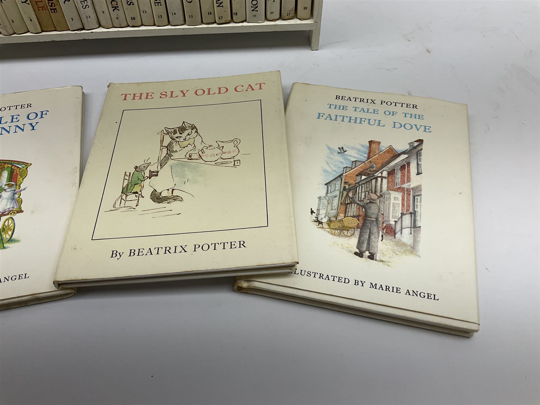 'Peter Rabbit's Book Shelf', containing selection of Beatrix Potter books, mostly library editions, shelf H29cm L27.5cm D11.5cm