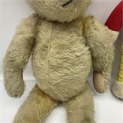 Deans Rag Book Mickey Mouse soft toy, circa 1930's, black velveteen head and body, with cream face and hands, red shorts and yellow felt shoes with leather soles, marked Reg. No. 750811 to neck H20cm; mid-20th century woodwool filled plush covered teddy bear with revolving head, applied eyes, vertically stitched nose and mouth and jointed limbs H52cm; soft toy figure of Rupert Bear; and Japanese clockwork tin-plate and plush covered mechanical toy of a gnome riding a donkey (4)