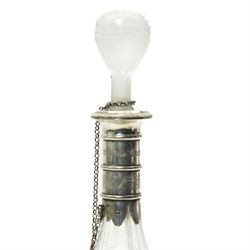 French glass decanter of baluster form with etched decoration and silver collar and foot H33cm