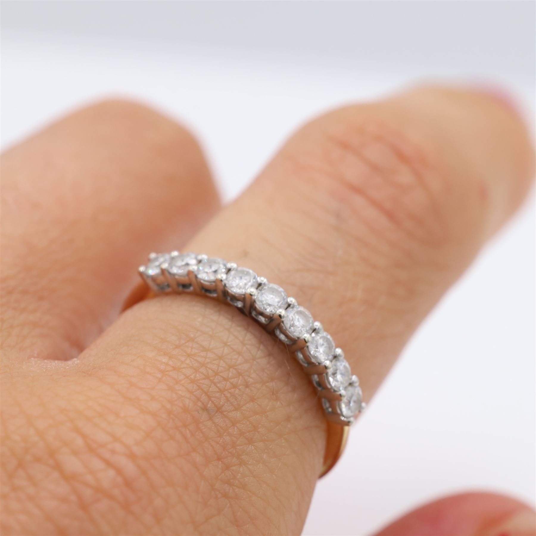 14ct gold diamond half eternity ring, set with nine blossom cut diamonds, stamped 14K, total diamond weight 0.54 carat, with GGI certificate