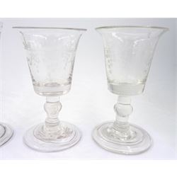 Group of eight 18th century and later drinking glasses, of various form and decoration, to include short ale glass with part wrythen twist drawn trumpet bowl upon circular foot, H13cm, dram glass with bucket bowl upon a knopped stem and folded circular foot, three examples with acid etched decoration of fruiting vines to the bowls, etc. 