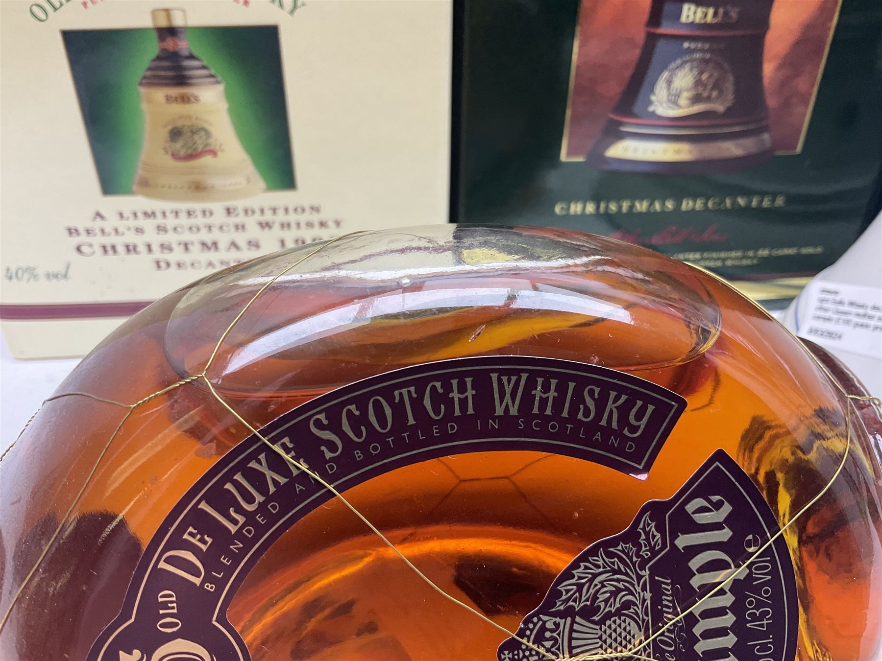 Dimple 15 Year Old Blended Scotch Whisky, together with nine Bells, scotch whisky, in Wade ceramic decanters, including Christmas 1991, 1998, 1996 etc, of various contents and proof 