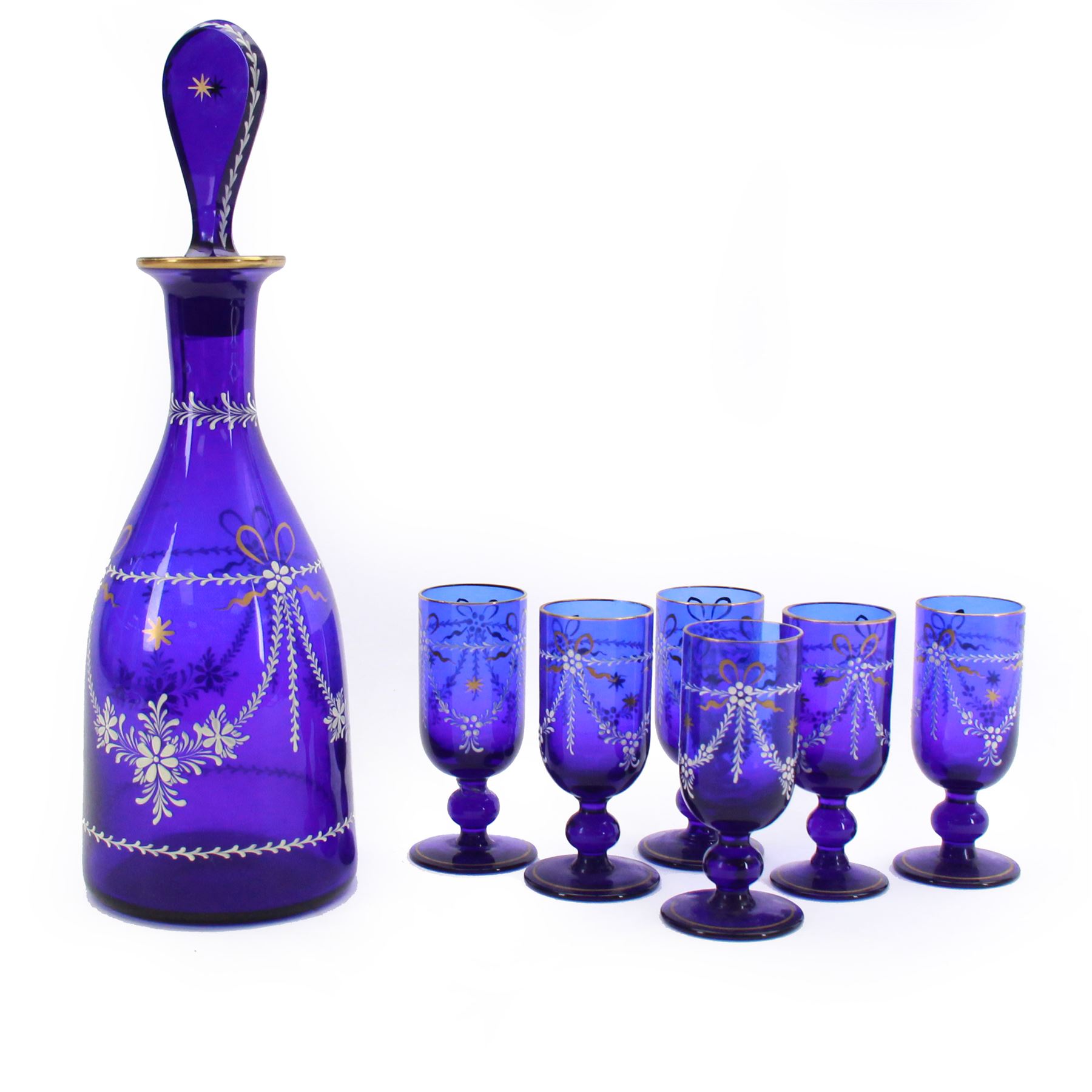 19th century style blue glass decanter and six drinking glasses, the decanter of mallet form with lozenge shaped stopper, all with white enamel and gilt swag decoration, decanter H34cm, drinking glasses H11.5cm