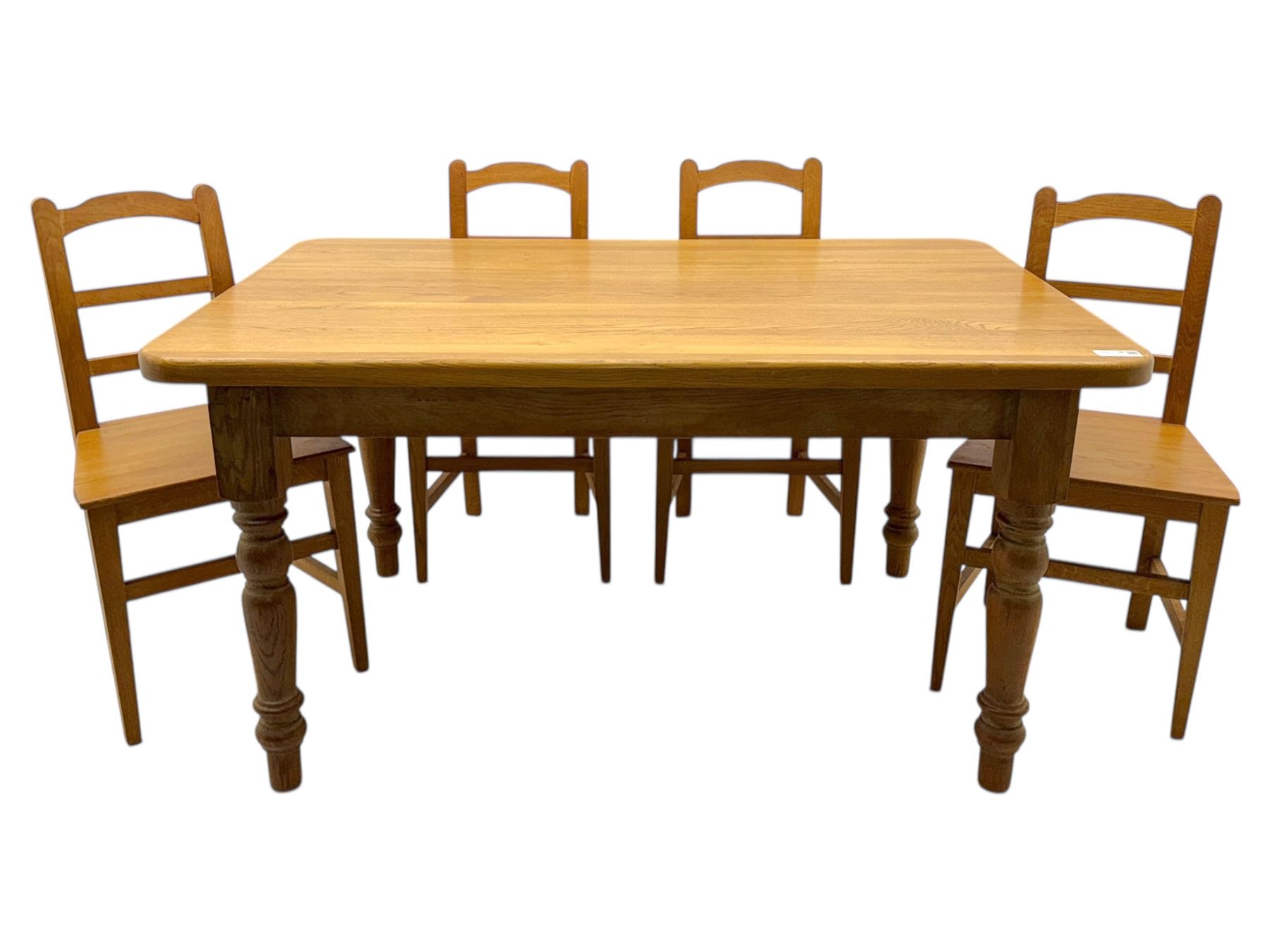 Contemporary light oak farmhouse dining table, and four oak ladder back dining chairs, rectangular top with rounded corners, raised on four turned baluster legs in natural lacquered finish, chairs with three horizontal slats beneath a shaped top rail, solid seat and square section legs united by stretchers