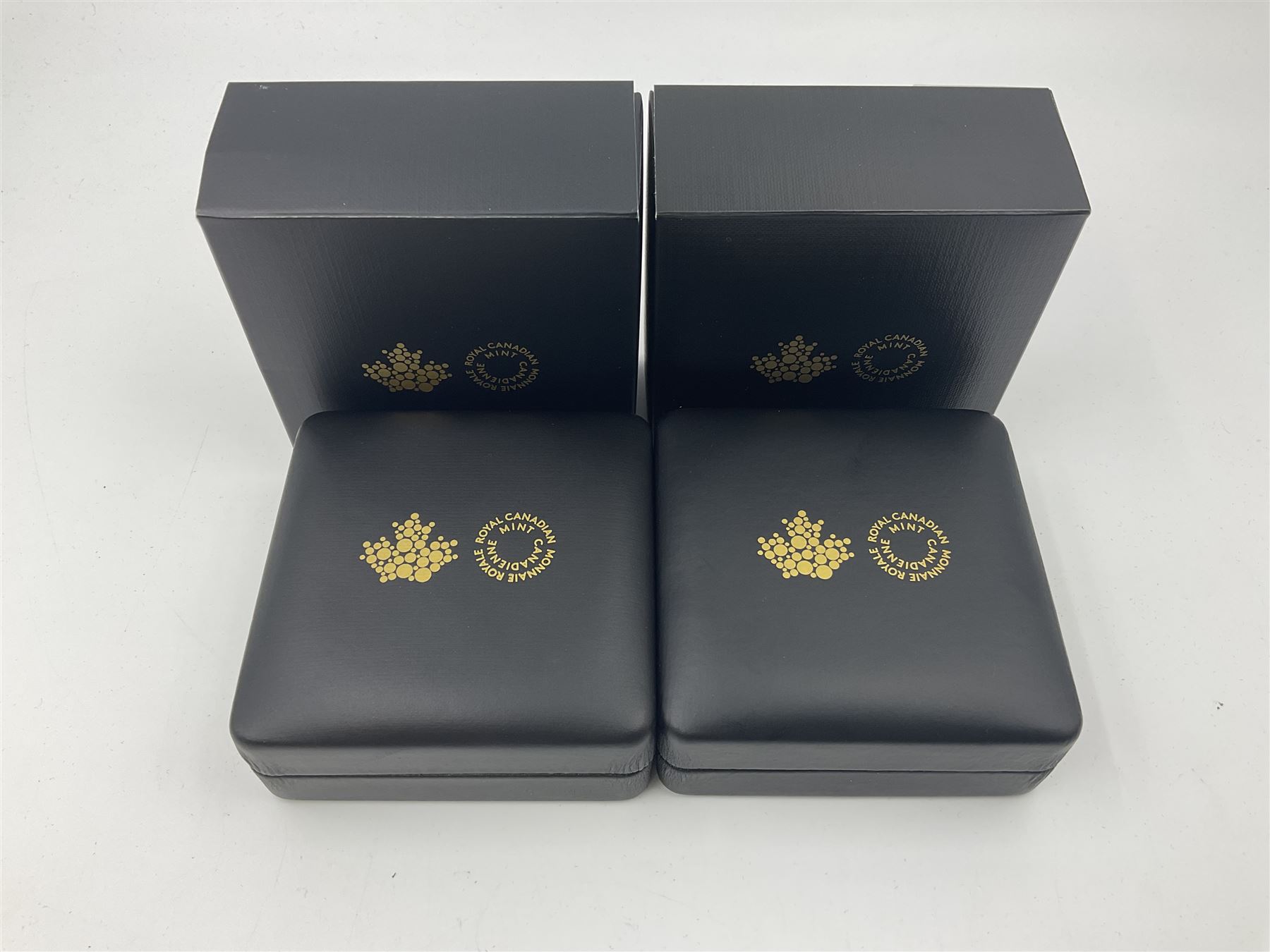 Royal Canadian Mint 2019 'Canada's Unexplained Phenomena The Shag Harbour Incident' fine silver twenty dollar coin and 2020 'Classic Mountie Hat' fine silver twenty-five dollar coin, both cased with certificates