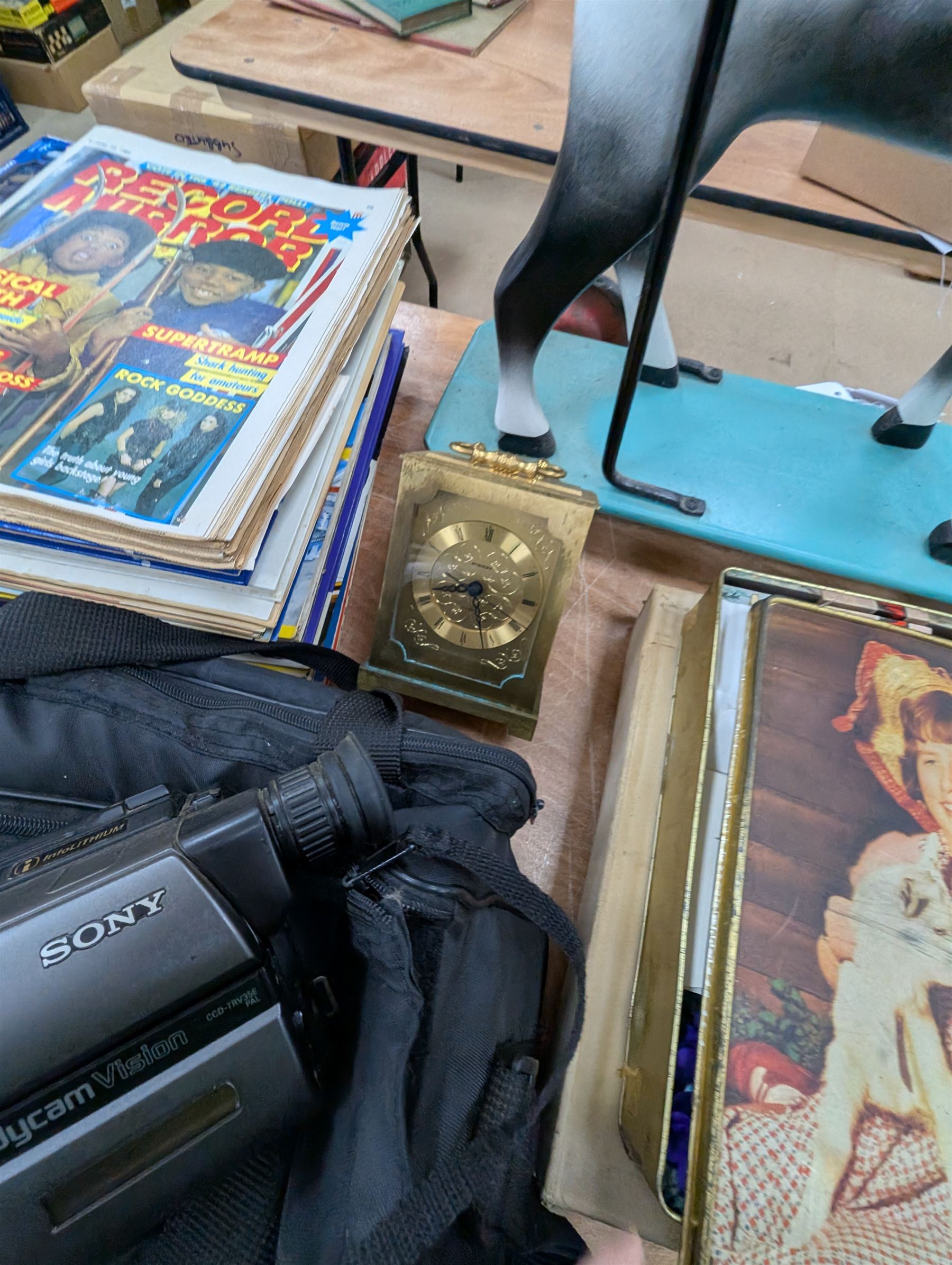 Dog cigarette box, glass decanter, two brass mantel clocks, snow globes, collection of Smash, Viz, Scorcher magazines, 1997 Glastonbury programme, JVC video camera, Sony Handy Cam and other collectables