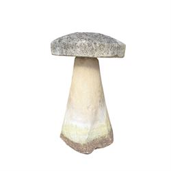 Weathered cast stone staddle stone with circular top raised on tapered base