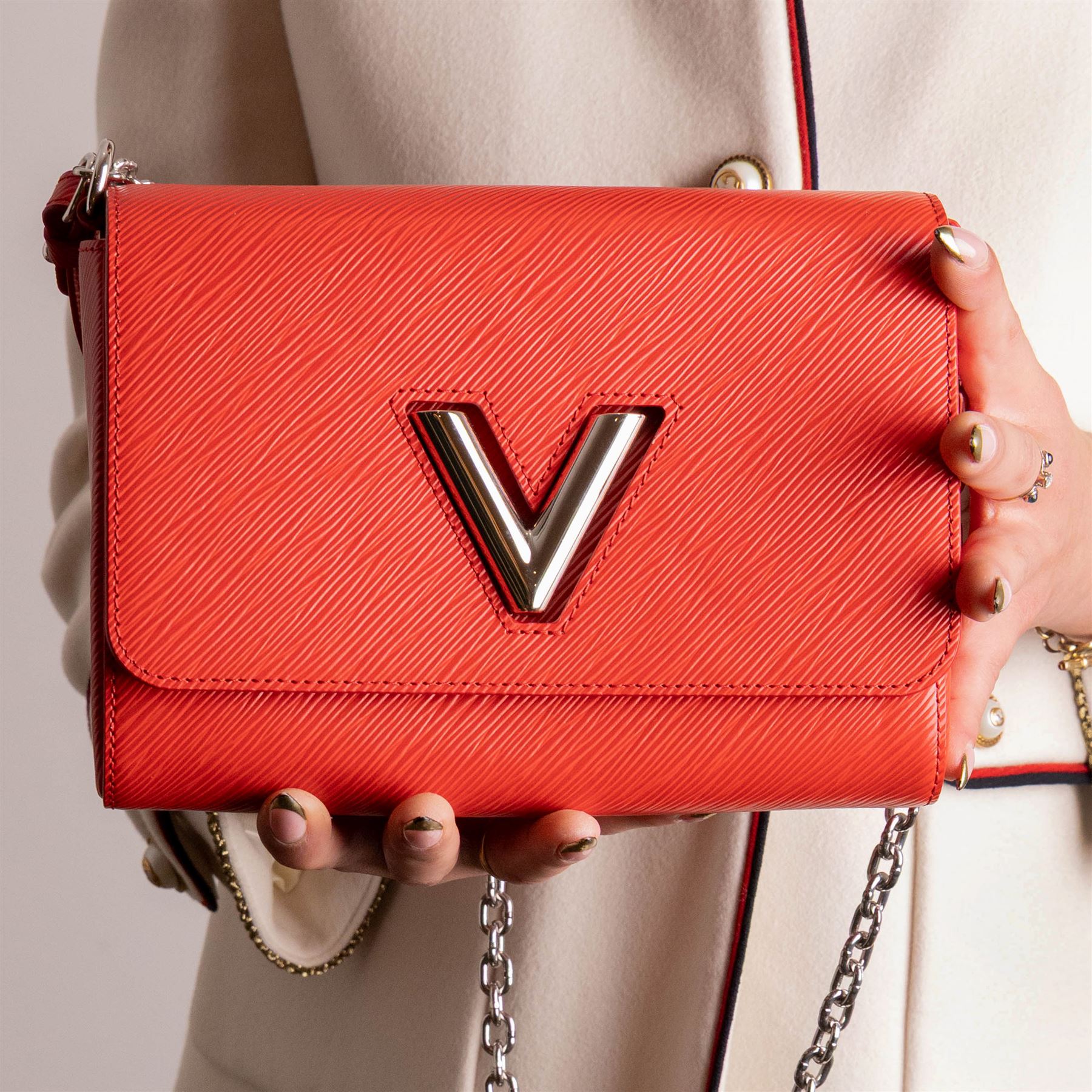 Louis Vuitton - ‘Twist’ MM Bag, the model introduced for the Cruise 2015 collection under Nicolas Ghesquière, in structured Coquelicot red Epi leather, with silver-tone LV twist-lock fastening and chain and carrying handle, with detachable flat leather shoulder or crossbody strap, unused with original box and dust bag
