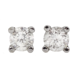 Pair of 18ct white gold single stone diamond stud earrings, stamped 750, diamond total weight 0.40 carat