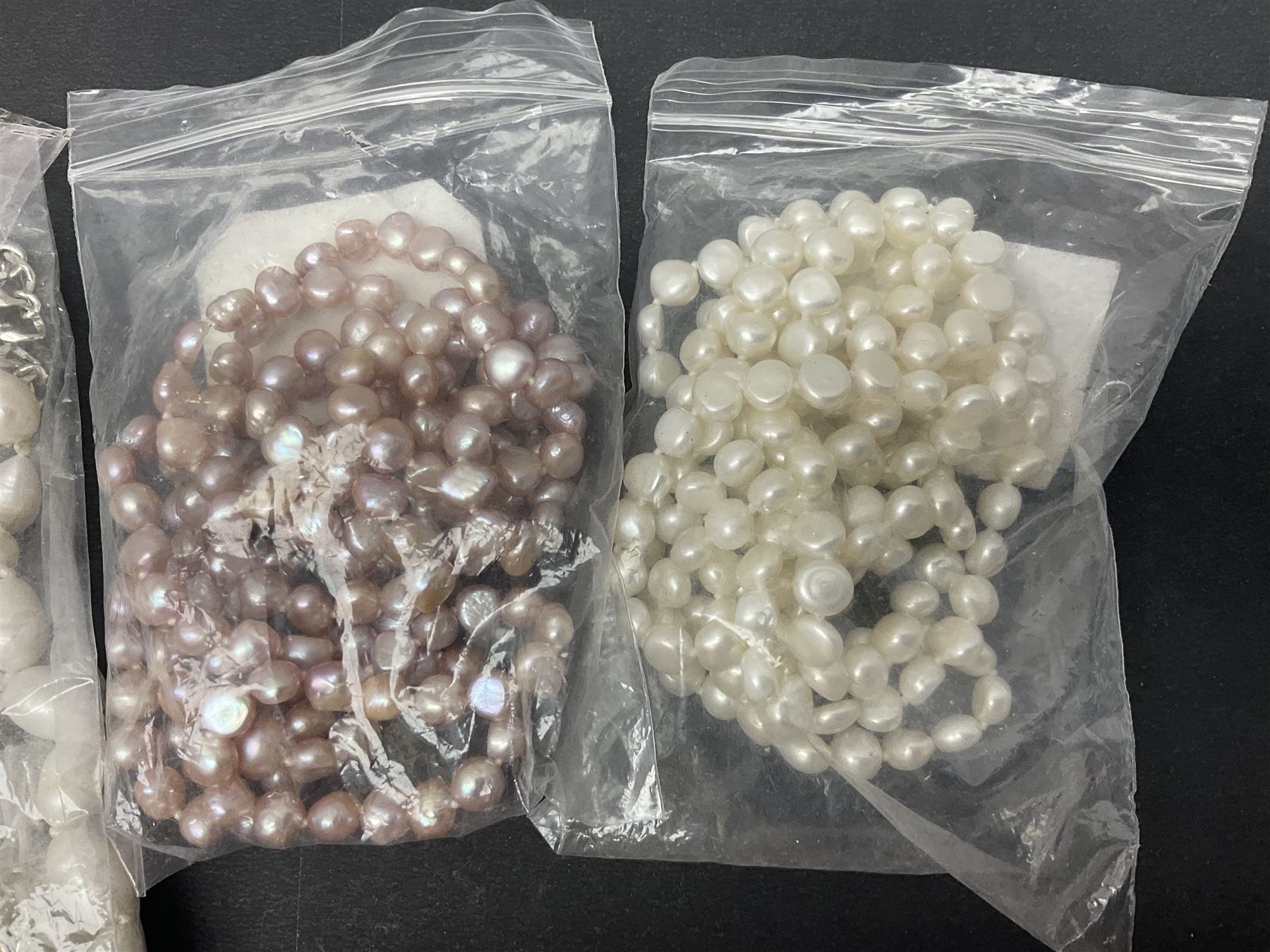 Fresh water pearl jewellery, including chain bracelet and seven necklaces, including pink example and some with silver clasps