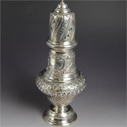 Victorian silver sugar caster, of bellied urn form, embossed with floral and foliate motifs, with two vacant cartouche, upon a domed stepped circular foot, with pierced removable cover with flambe finial, hallmarked Marston & Bayliss, Chester 1900, H25cm
