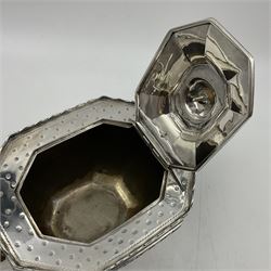 Victorian silver four piece tea service, comprising teapot, teapot stand, twin handled open sucrier and milk jug, each of octagonal form with foliate bud border and engraved decoration including crest to canted panels, and vacant panels, the teapot with ivory finial to the hinged cover and later wooden handle, hallmarked Edward Barnard & Sons Ltd, London1896, teapot including finial H15cm, milk jug including handle H16cm, teapot stand W11.5cm

This item has been registered for sale under Section 10 of the APHA Ivory Act