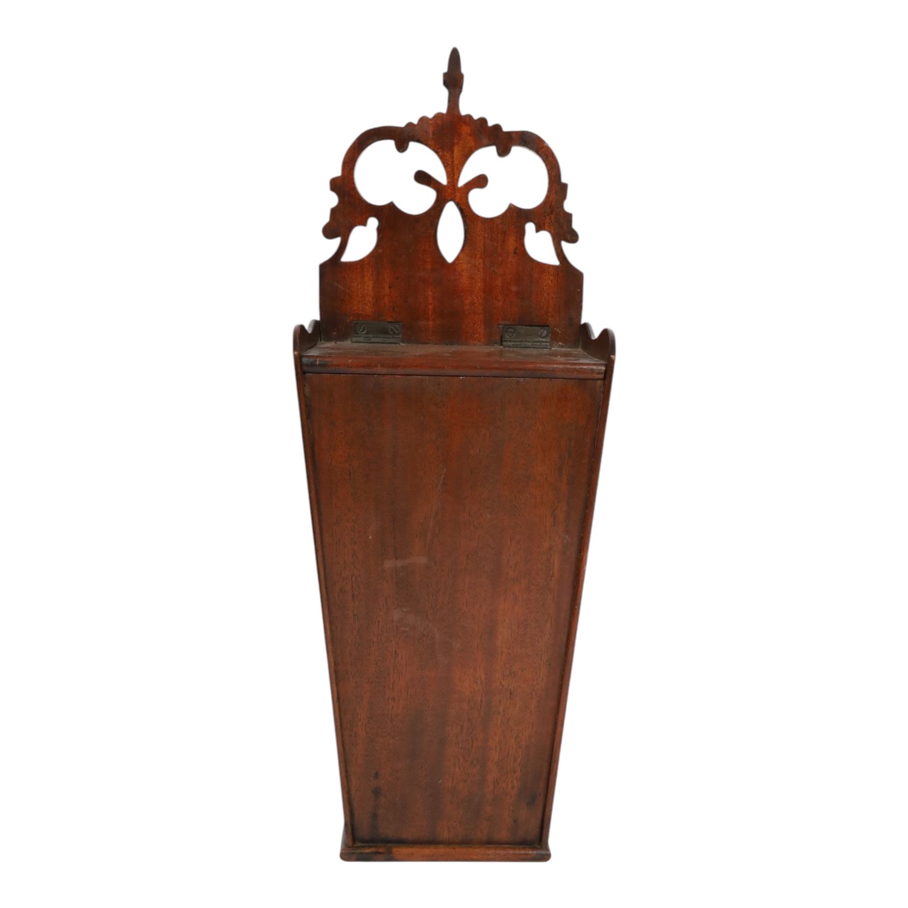 Three George III and later oak candle boxes, the first example of tapering form with shaped and pierced scroll crest, above a hinged lid, H50.5cm W18cm D13cm, the second of plain rectangular form with tapering crest, above a studded leather hinged sloped lid, H46cm W15.5cm D15.5cm, and third of plain rectangular form with demi-lune crest, with lift up front, H42.5cm W17.5cm D12cm 
