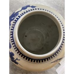 Late 19th century Chinese blue and white ginger jar, of ovoid form with flat topped circular cover, the body decorated with a geisha on reindeer with attendant in a landscape setting, with apocryphal Kangxi mark beneath, H24cm