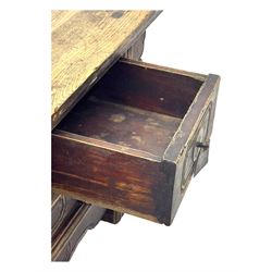 Mid-19th century elm low altar table, rectangular top with scrolled ends, fitted with three small drawers, pierced and scroll carved brackets, on square moulded supports 