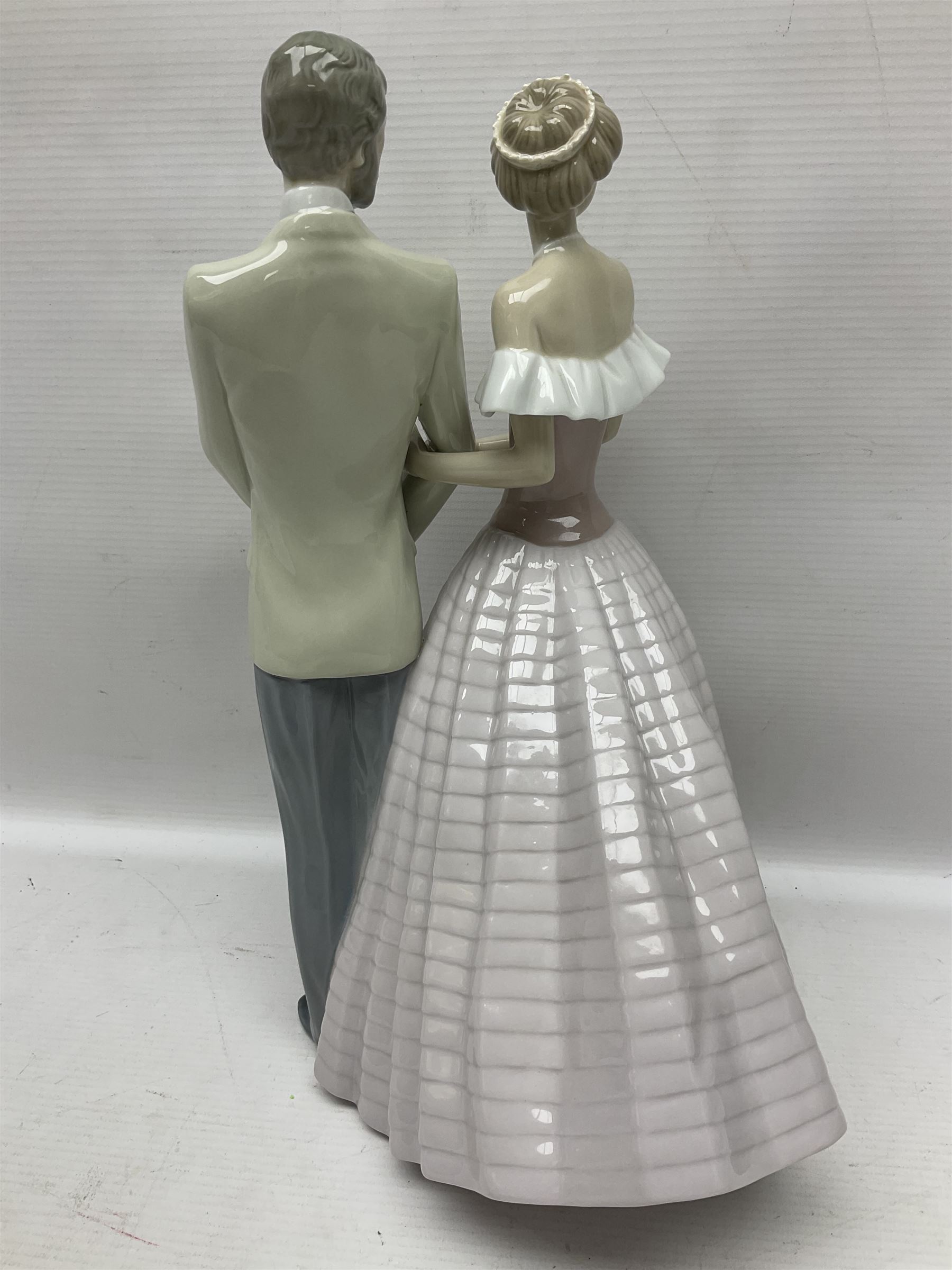 Lladro figure, An Evening Out, modelled as a man and women in evening dress, no 5540, year issued 1988, year retired 1991, H32cm