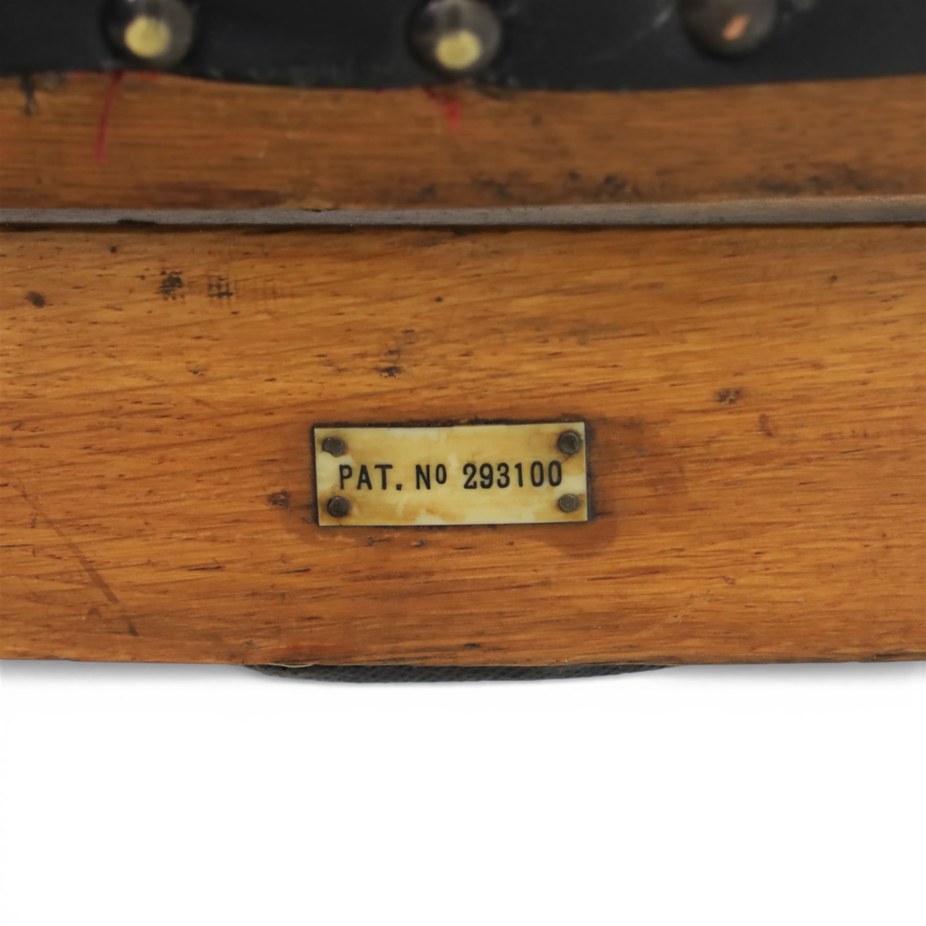 20th century oak recliner armchair, the curved back upholstered in leather with brass stud edging, hinged reclining back operated by side ratchet fittings, leather upholstered seat, shaped open arms, raised on cabriole legs