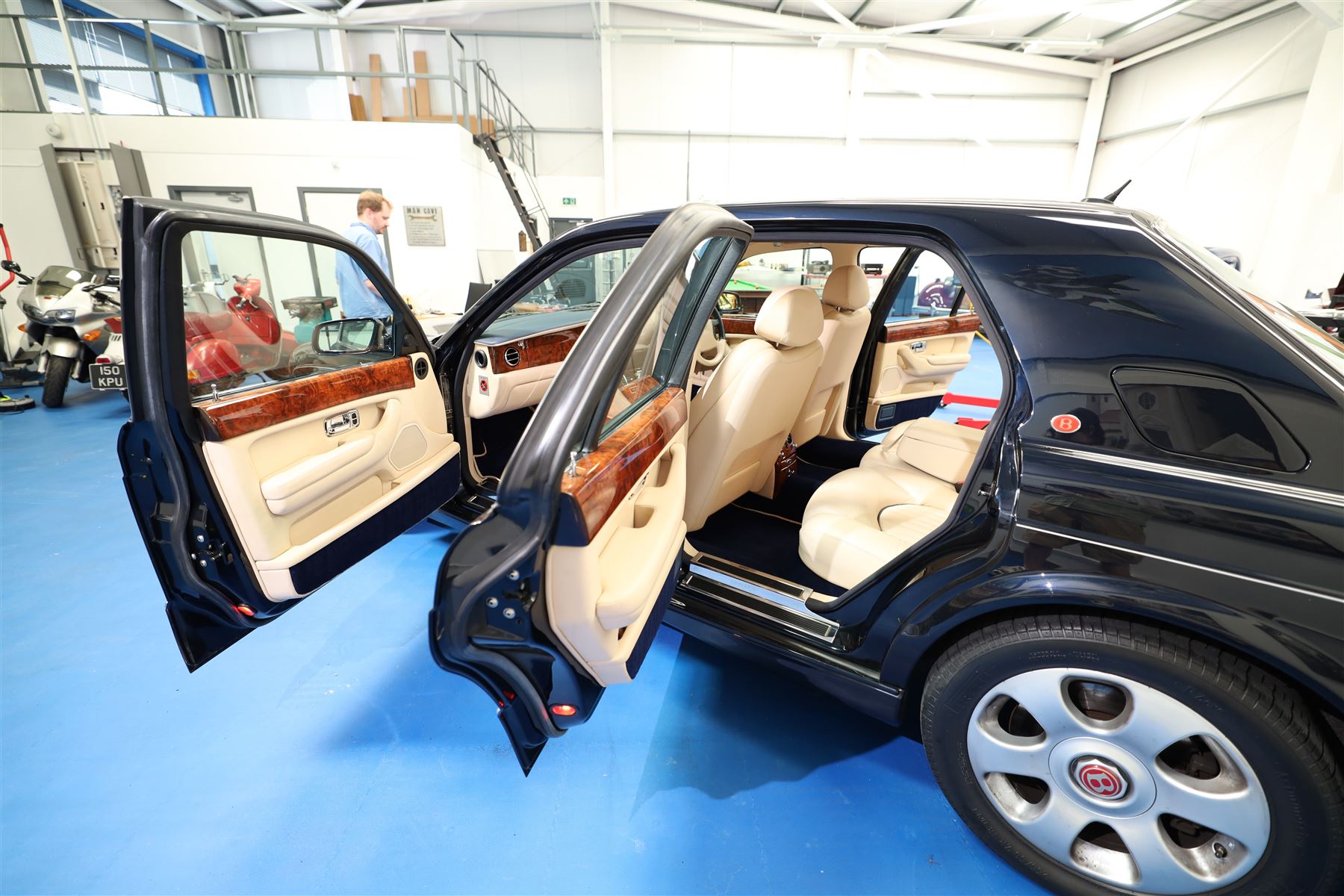 2001 Bentley Arnage Red Label Saloon

Registration: BU51 TGX
Engine: 6.75-litre turbocharged V8 petrol
Transmission: Automatic
Odometer reading: 39,942 miles
Colour: Black Sapphire metallic
Interior: Magnolia leather with burr walnut veneers
Previous owners: 3
V5C: Present
Service history: Good service records

An exceptional Bentley Arnage Red Label Saloon, finished in Black Sapphire metallic, a very dark blue, with a Magnolia leather interior, contrasting dark blue carpets and extensive burr walnut veneers. The car displays an odometer reading of approximately 39,942 miles.

The Arnage Red Label combined Bentley’s renowned 6.75-litre turbocharged V8 engine with automatic transmission, delivering effortless performance in a traditionally appointed luxury saloon. The model is distinguished by its imposing proportions, characteristic Bentley radiator grille and finely crafted interior.

Presented in excellent condition throughout, the bodywork and metallic paint finish appear particularly well preserved, complemented by clean brightwork and the correct Bentley alloy wheels. The engine bay is also notably well detailed.

The interior presents exceptionally well, retaining its Magnolia leather upholstery, polished burr walnut veneers, original factory instrumentation and switchgear. The leather displays only light creasing consistent with careful use.

The car has had three previous owners and is accompanied by good service records.

Features

• 6.75-litre turbocharged V8 petrol engine
• Automatic transmission
• Black Sapphire metallic paintwork
• Magnolia leather interior
• Contrasting dark blue carpets
• Burr walnut veneers
• Electrically adjustable front seats
• Air conditioning
• Factory instrumentation and switchgear
• Bentley alloy wheels
• Right-hand drive
• Odometer reading of approximately 39,942 miles
• Three previous owners
• Good service records
• V5C present

This vehicle forms part of the Estate of the Late John Sills and is offered for sale by the Executors, confirming a genuine reason for sale.