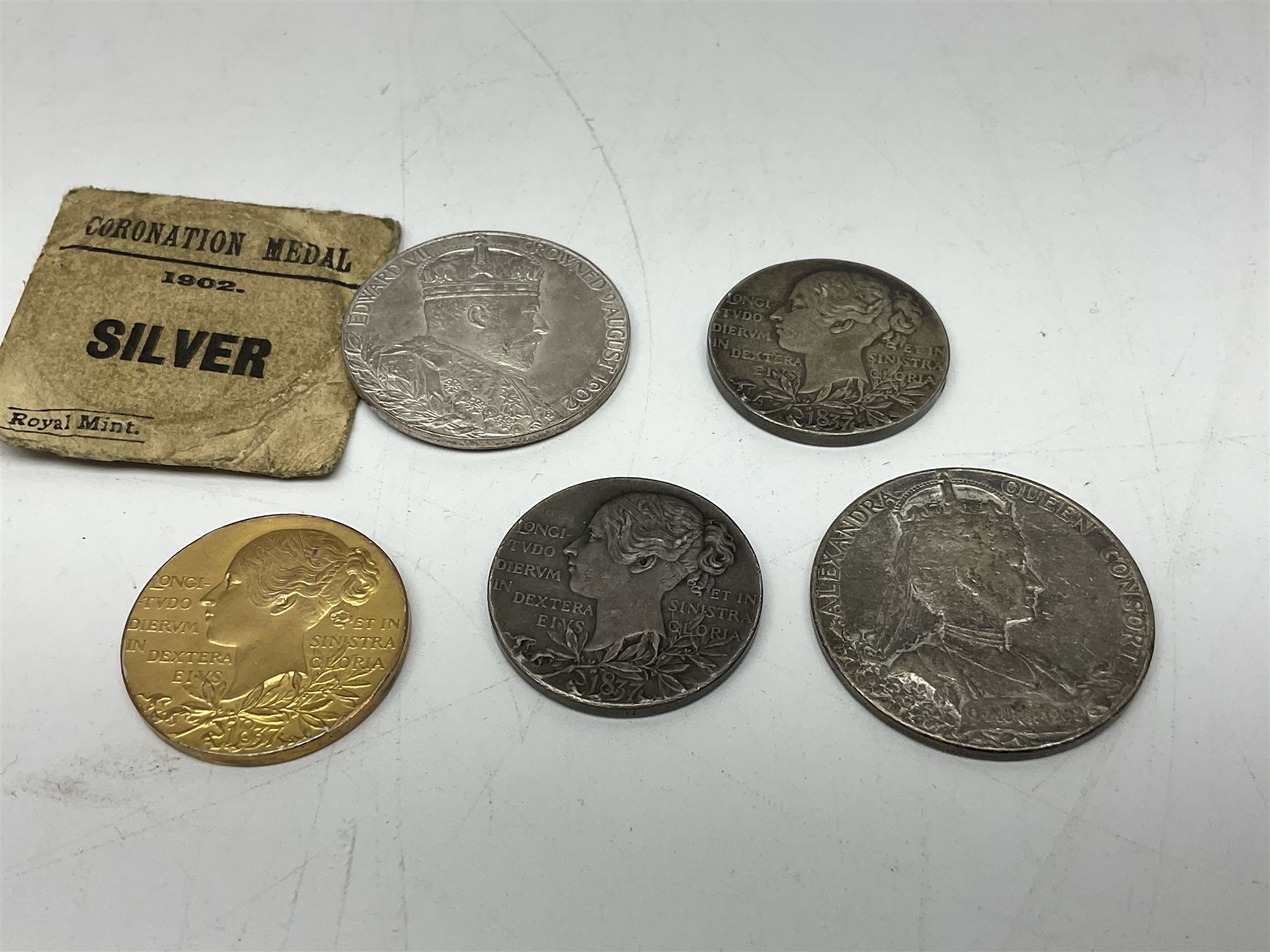 Commemorative medallions or medals including three Queen Victoria Diamond Jubilee small silver medallions, two King Edward VII 1902 Coronation medallions and a Queen Elizabeth II 1953 Coronation medal in red box