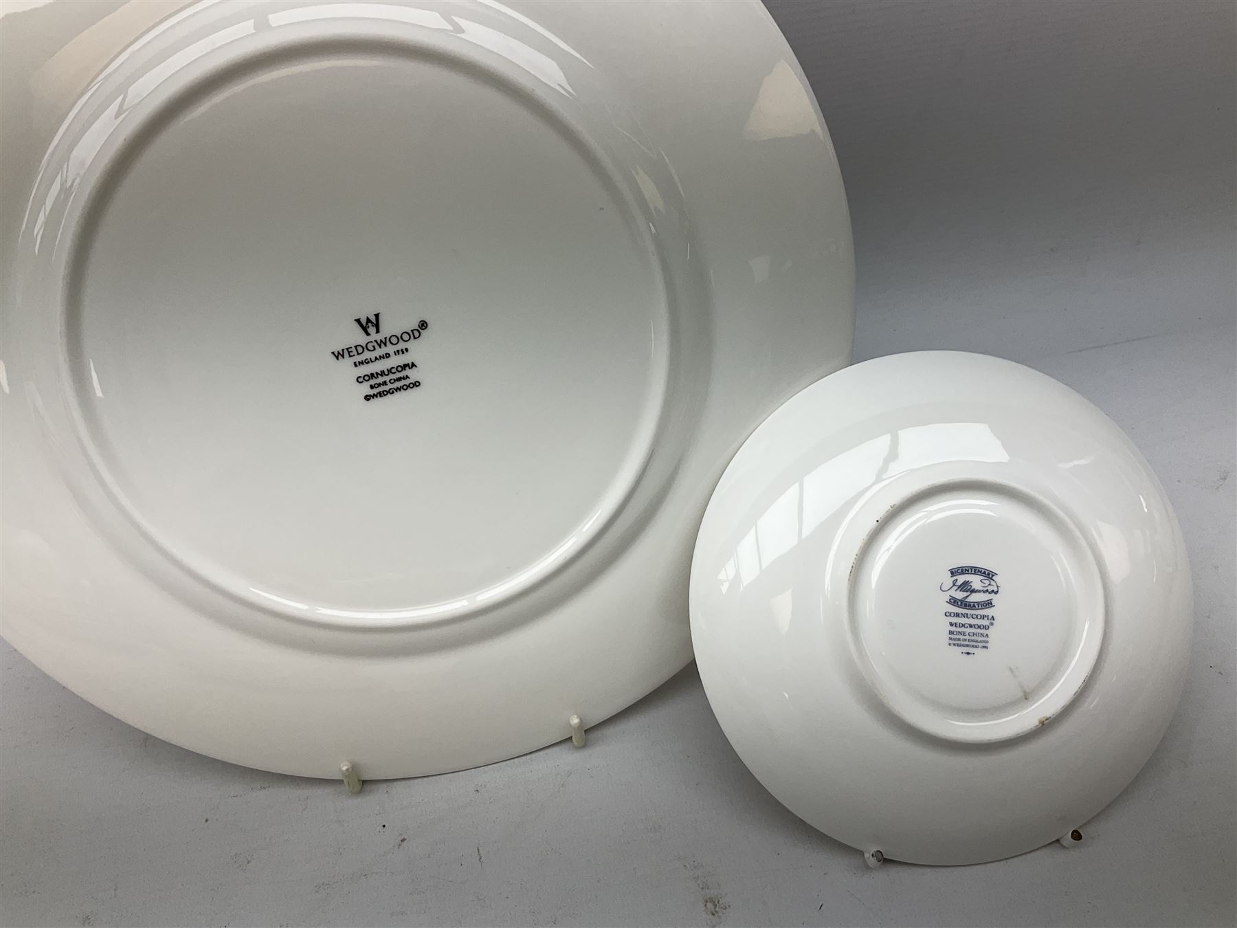 Wedgwood cornucopia pattern tea and dinner service, comprising teapot, ten cups and saucers, milk jug, open sucrier, eight dessert plates, fourteen dinner plates, eight side plates, six bowls, two open serving dishes and one covered twin handled dish (53)