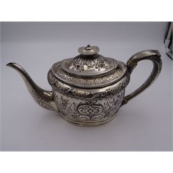 George III silver teapot, of oval form, with embossed foliate, floral and scroll decoration and engraved central cartouche, with acanthus capped C handle with ivory insulators, hallmarked John Emes, London 1807 This item has been registered for sale under Section 10 of the APHA Ivory Act
