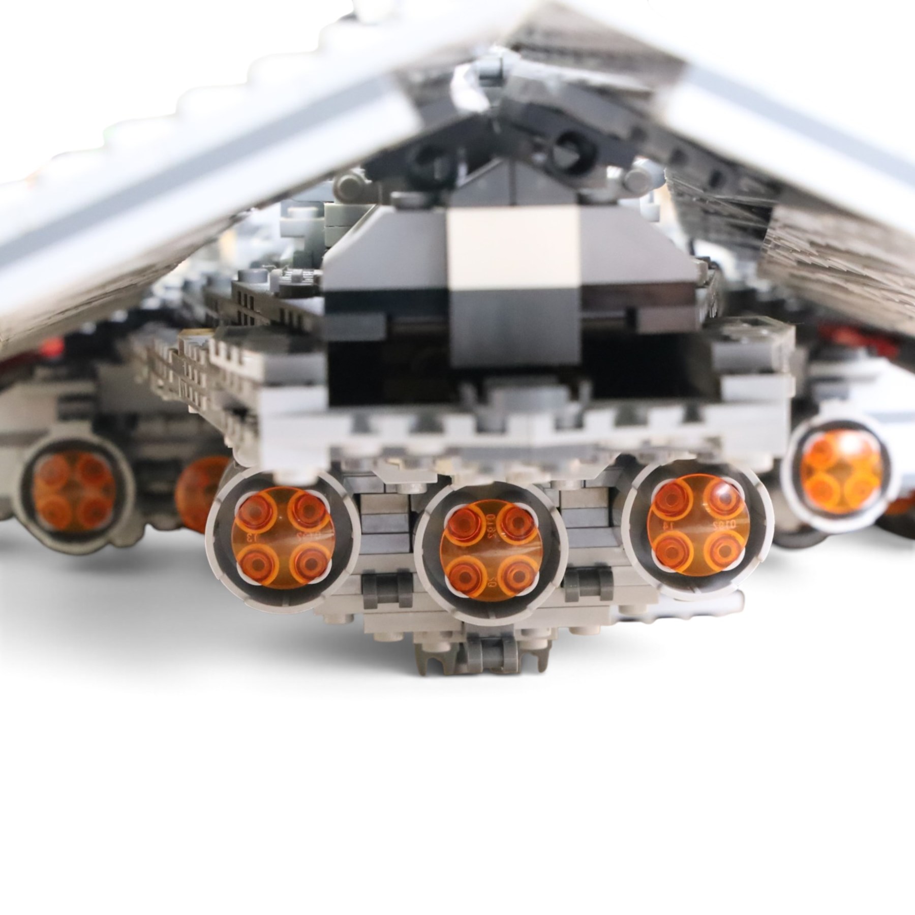 Three Lepin Star Wnrs built models, comprising Red Five X-Wing Starfighter no. 05039, Millennium Falcon no. 05132 and Super Star Destroyer no. 05028
