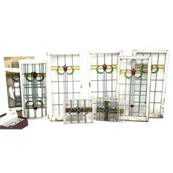 Collection of stained and leaded glass windows and panes, stylised floral design, various sizes, the largest window measuring 55cm x 112cm (including wooden frame)