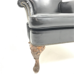 Georgian style armchair, shaped cresting rail, scrolling arms, carved cabriole suports, upholstered in studded black leather, W82cm