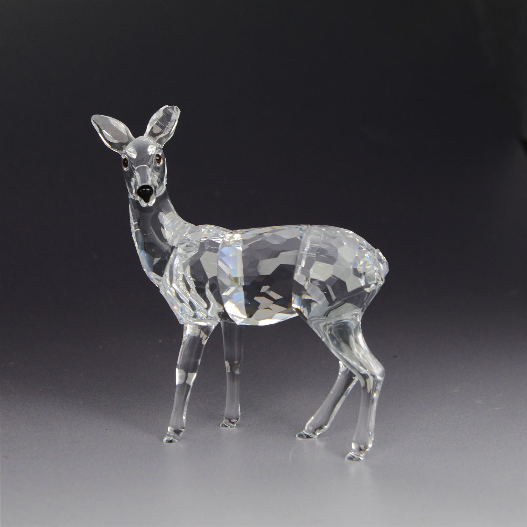 Two Swarovski figures, comprising Doe and Christmas Stag, both in original boxes 