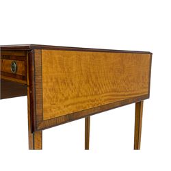 Mid-to-late 20th century Sheraton style satinwood Pembroke table, the drop leaf top with segmented veneers and central oval panel with ebony stringing, crossbanded in rosewood and with edge moulding, single short drawer to one end and faux drawer to other, square tapering supports