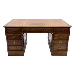 Victorian style figured elm twin pedestal desk, moulded rectangular top with inset leather, fitted with seven drawers, the lower two filling drawers are double height, the opposing side fitted with false drawers, each side fitted with pull slides with leather insets, skirted base