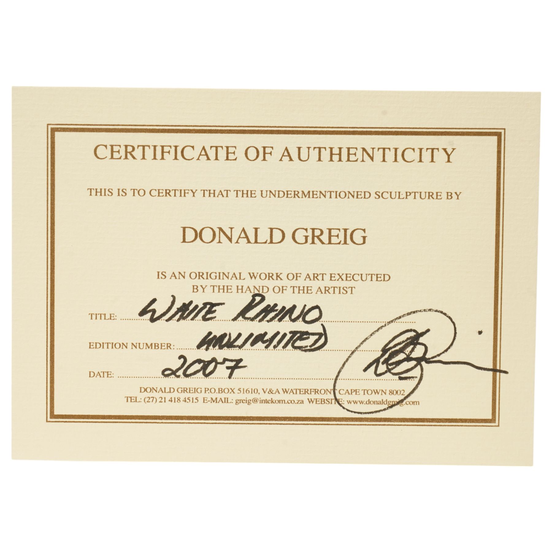 Donald Greig (South African 1959-): Recumbent White Rhino, bronze, signed, 2007,  5cm x 12cm with certificate