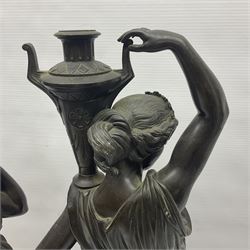 Pair of bronzed female figures, in neoclassical dress, each holding an urn upon her shoulder, H51cm
