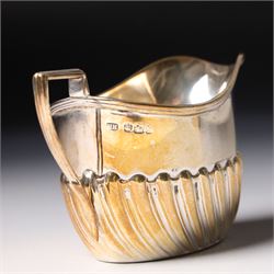 Late Victorian bachelors silver tea set of oval form with half body decoration, the teapot with ebonised handle and lift Sheffield 1895 Maker Harrison Bros. & Howson