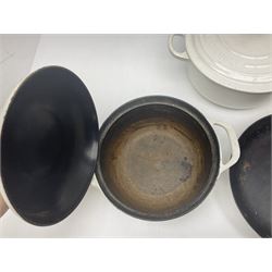 Le Creuset cast iron casserole dish, together with two Waterford cast iron dishes and a frying pan