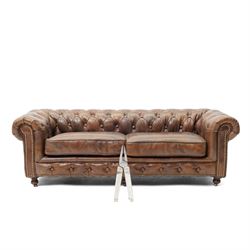 Miniature brown leather button back Chesterfield sofa, with castors 